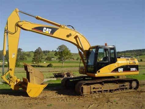 a yellow excavator is parked in a field at Welding Skills center Plant machinery Training in Germiston