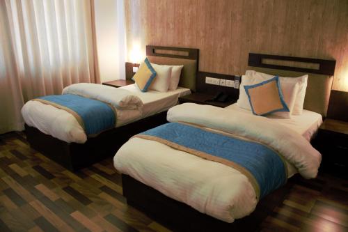 Postel nebo postele na pokoji v ubytování Hotel Tulip Pvt Ltd