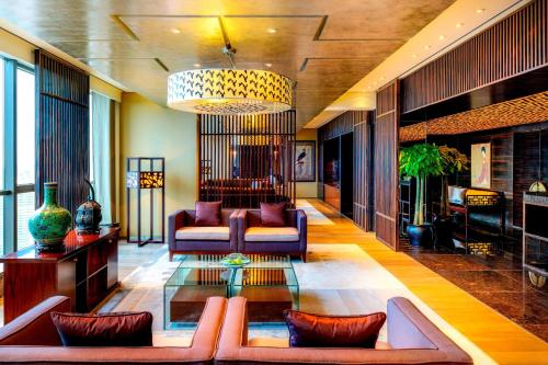 a living room with a couch and a table at The Westin Beijing Chaoyang in Beijing