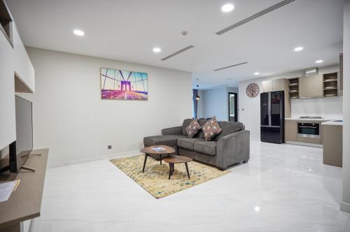 a living room with a couch and a table at URBAN PALACE in Phnom Penh