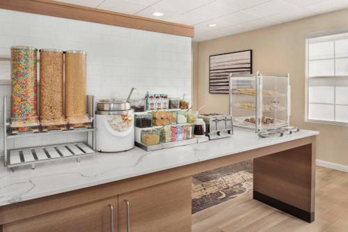 a kitchen with a counter with food on it at Residence Inn Kansas City Independence in Independence