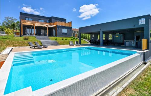 a swimming pool in front of a house at Beautiful Home In Klostar Ivanic in Kloštar Ivanić