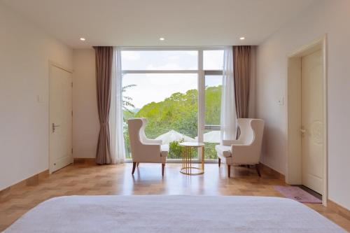 Ένα ή περισσότερα κρεβάτια σε δωμάτιο στο Rose villa 35d2 Đà lạt