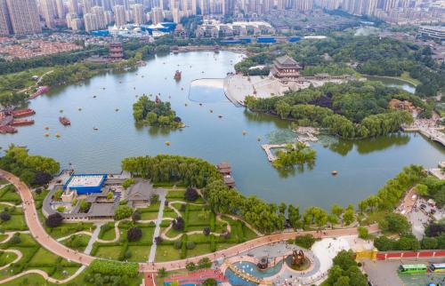an aerial view of a park with a lake at Dm kara Rus Hotel - Muslim Street Branch in Xi'an