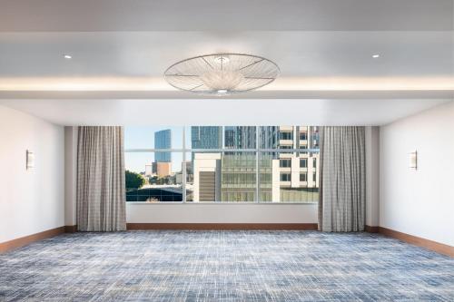 a large room with a large window with a view at JW Marriott Los Angeles L.A. LIVE in Los Angeles