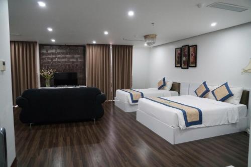 Ένα ή περισσότερα κρεβάτια σε δωμάτιο στο New Century Hotel