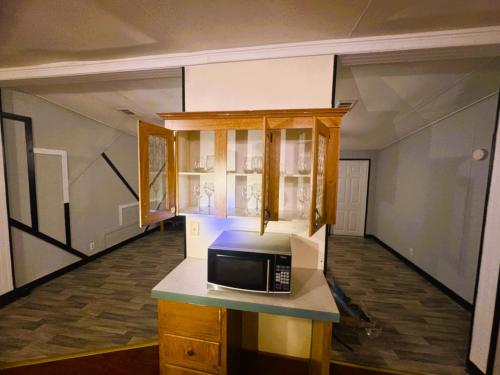 a kitchen with a microwave on top of a counter at Beautiful two bedroom house in Lake Wales