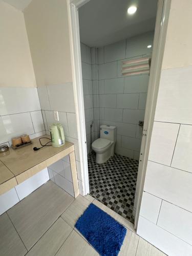 a bathroom with a toilet and a sink at Tam duc villa in Tây Ninh