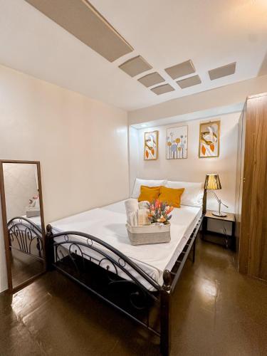 a bedroom with a bed in a room at The Loft in Cabanatuan