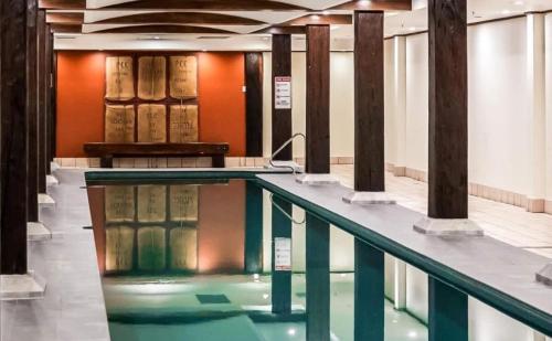 a swimming pool in a building with books at Luxe suite in Darling Harbour with pool, sauna & gym - ICC 300m in Sydney