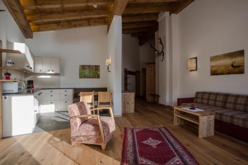 a living room with a couch and a table at Alte Schmiede Hiltpolt in Seefeld in Tirol