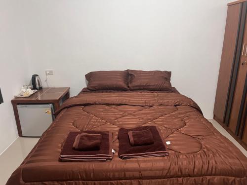 Postel nebo postele na pokoji v ubytování ห้องพักคุณเล็ก ห้วยโป่งฟาน