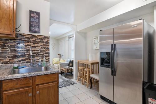 a kitchen with a stainless steel refrigerator at USNA Home In Downtown Annapolis in Annapolis