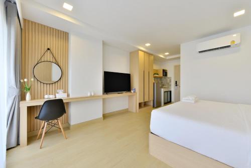 TV a/nebo společenská místnost v ubytování V32 Hotel