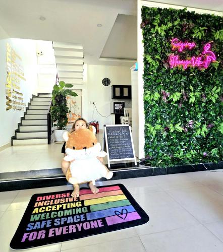 a stuffed animal sitting on a rug in a store at Flamingo Villa Homestay - Big Rooms with Balcony - Close to Hoi An Old Town 200m & Temple Bridge - Large Outside Pool for Sun Bathing in Hoi An
