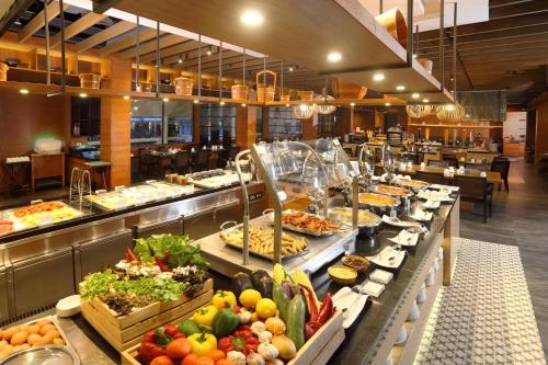 a buffet line with many different types of food at Le Meridien Phuket Beach Resort in Karon Beach