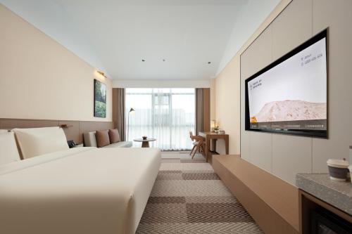 TV a/nebo společenská místnost v ubytování Atour Hotel Suzhou Beisi Pagoda Taohuawu Street