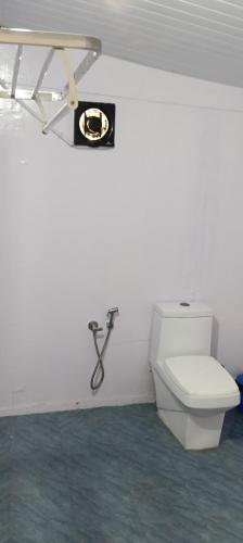 a bathroom with a toilet in a room at Casa Beach hut Resort in Palolem