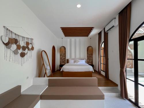 a bedroom with a bed in a room at Tujuan Jogja Villas Arjuna With Private Pool in Jetis