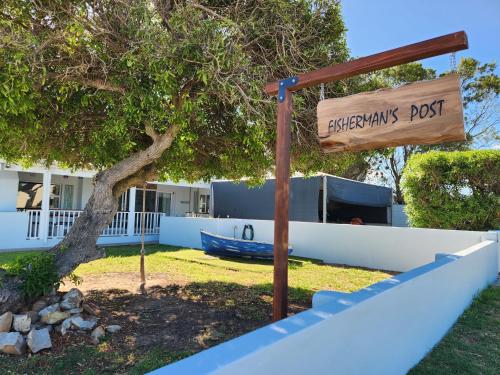 a sign for theerkinks post in front of a house at Fisherman's Post in Gouritzmond