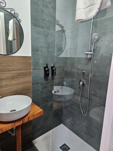 a bathroom with a shower and a sink at Tresor in Polignano a Mare
