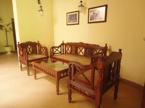 a group of beds in a room at Dedduwa Boat House in Bentota