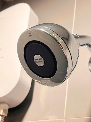 a pair of headphones hanging on a toilet at BB HOUSE Rangsit in Ban Talat Rangsit
