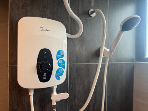 a soap dispenser on the wall of a bathroom at X - The Papermill - Sunway Subang Jaya USJ1 SEGi Monash INTI Taylor Sunway Lagoon in Subang Jaya