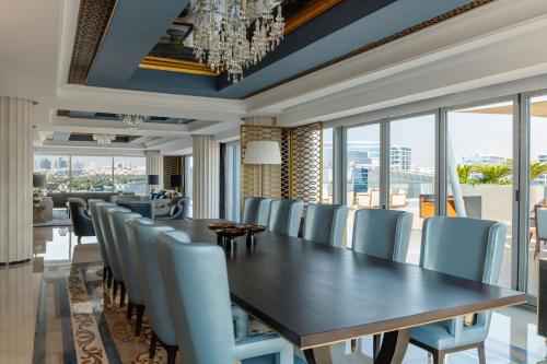 a dining room with a table and chairs at Marriott Marquis Dubai Creek in Dubai