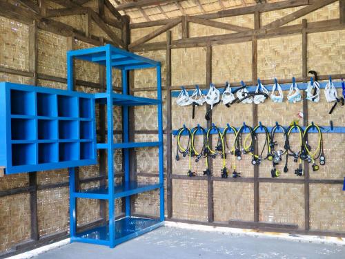 a blue rackets hanging on a wall at The Wild Orchid Resort - Moalboal in Moalboal