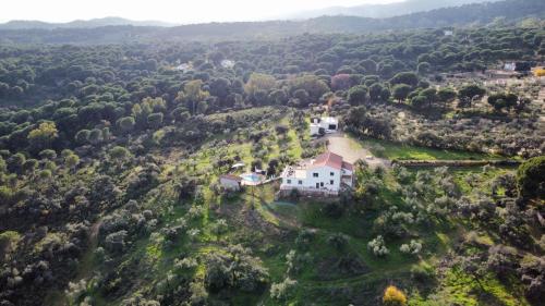 an aerial view of a house on a hill at Casa rural DOS ENCINAS in Andújar