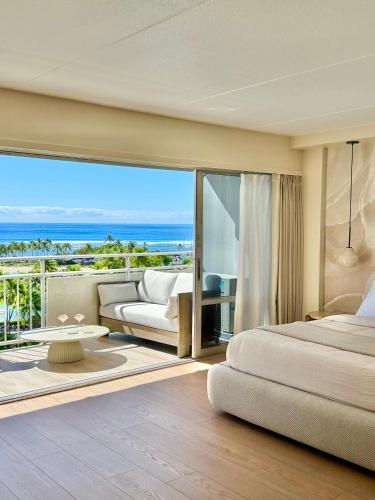 a bedroom with a bed and a view of the ocean at Panoramic Oceanview Resort - Full Kitchen in Each Unit, 2 Swimming Pools, Onsite Restaurants, Fireworks Every Friday in Honolulu