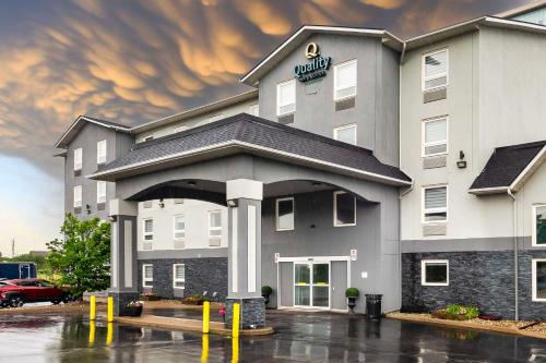 a hotel with a parking lot in front of it at Quality Inn & Suites in Grimsby