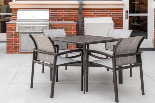 a black table and chairs on a patio at Residence Inn by Marriott Oklahoma City Norman in Norman