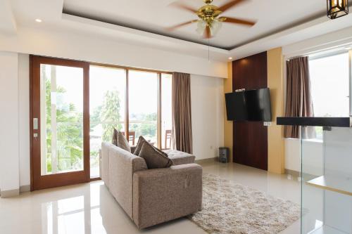 Μια τηλεόραση ή/και κέντρο ψυχαγωγίας στο GM Guest House Canggu