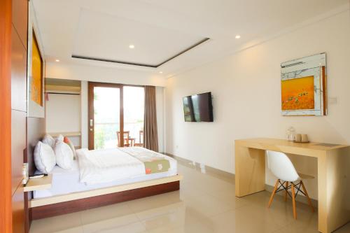 Ένα ή περισσότερα κρεβάτια σε δωμάτιο στο GM Guest House Canggu