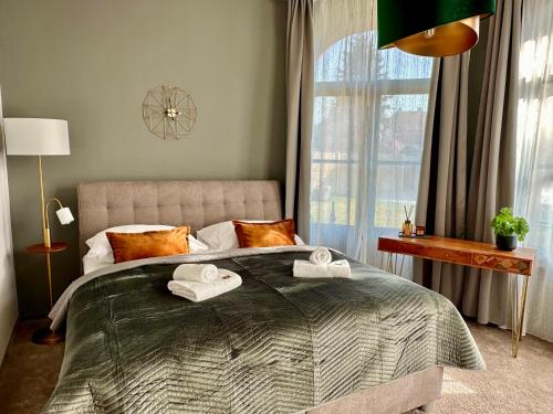 Postel nebo postele na pokoji v ubytování Residence Barrique Valtice - private wellness
