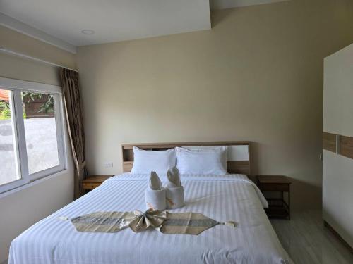 Postel nebo postele na pokoji v ubytování Natural Samui Hotel