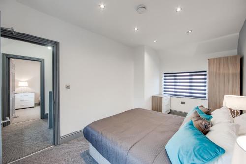 a bedroom with a large bed and a mirror at Your Perfect Ashford Retreat Pet-Friendly & Business Ready in Ashford