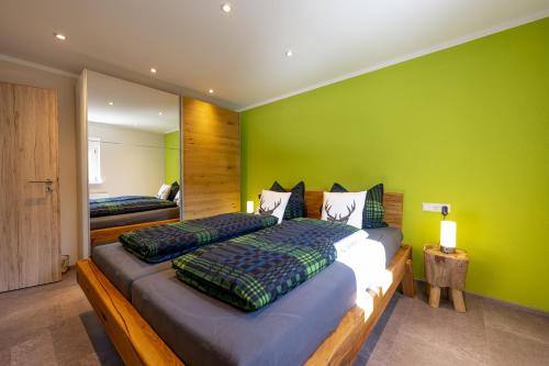 Postel nebo postele na pokoji v ubytování Ferienwohnungen Schwarzwaldzauber