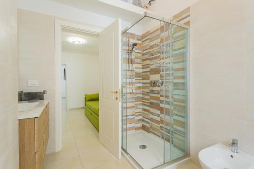 a bathroom with a shower and a sink at Ricasoli27 in Mottola