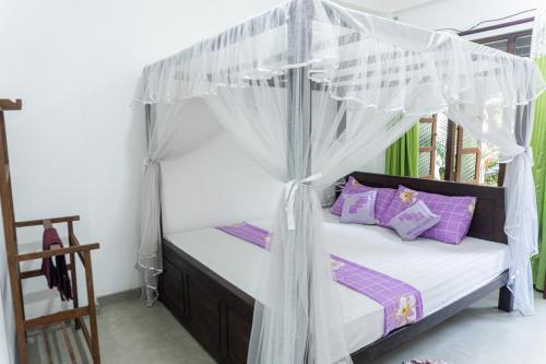 Postel nebo postele na pokoji v ubytování DKC Apartment