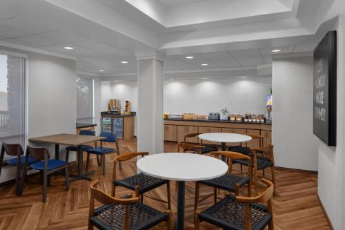 a restaurant with tables and chairs and a counter at Richfield Fairfield Inc in Richfield