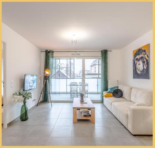 a living room with a couch and a table at Le 1848 I T2 I Cluses in Cluses