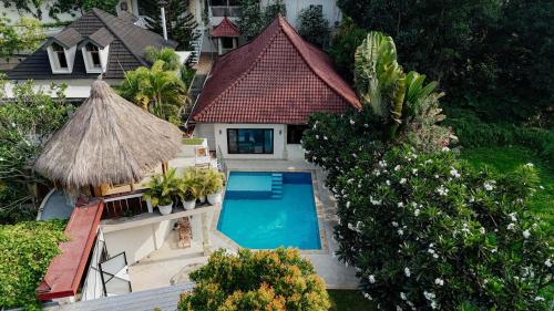 an aerial view of a house with a swimming pool at Ombe Villa in Labuan Lombok