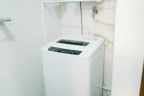 a washing machine in a bathroom with a shower at YY-Minamicho 1 room-IT0339 in Tokyo