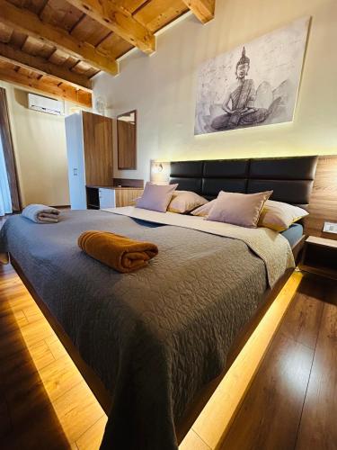 a bedroom with a large bed in a room at Harmónia Vendégház in Miskolctapolca
