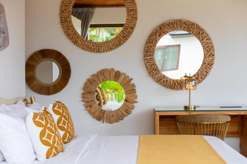 a bedroom with mirrors on the wall and a bed at Here and Now - Luxury Sea view & Spa Villa in Koh Samui 