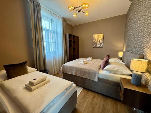 Postel nebo postele na pokoji v ubytování Residence Barrique Valtice - private wellness