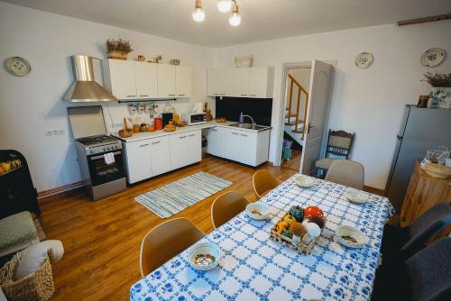 a kitchen with a table with food on it at Prispa Casei in Floreşti